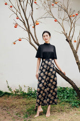 Structured silk blouse with short flared sleeves and high neckline for elegant styling